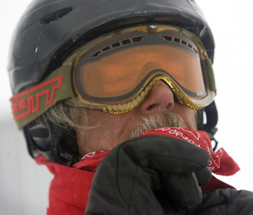 Al Hartmann  |  The Salt Lake Tribune 
Donald Derby pulls on his goggles and bandana at the top of Snowbird's Hidden Peak recently for his first run of the day. Last winter, he put together a spread sheet documenting all 133 days he skied, accumulating more than 6 million vertical feet, averaging 22 runs a day on days that lasted more than 6.6 hours.  This year, at age 67, he plans to top that.