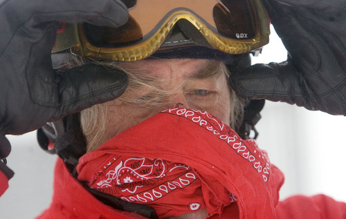 Al Hartmann  |  The Salt Lake Tribune 
Donald Derby pulls on his goggles at the top of Snowbird's Hidden Peak recently for his first run of the day.  Last winter, he put together a spread sheet documenting all 133 days he skied, accumulating more than 6 million vertical feet, averaging 22 runs a day on days that lasted more than 6.6 hours.  This year, at age 67, he plans to top that.