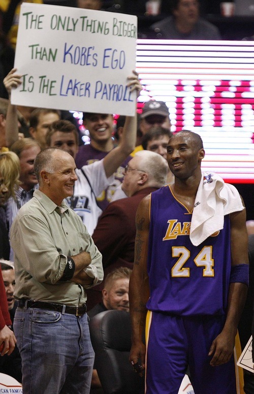 Trent Nelson  |  The Salt Lake Tribune
Los Angeles Lakers guard Kobe Bryant (24) smiles after sharing words with a fan holding a sign referencing Bryant's ego. Utah Jazz vs. Los Angeles Lakers, NBA basketball Friday, November 26, 2010 at EnergySolutions Arena.