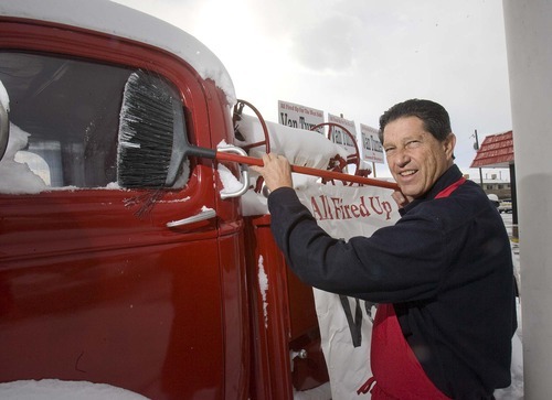 Paul Fraughton | The Salt Lake Tribune

Van Turner, a city councilman from Salt Lake City's District 2, on Wednesday sweeps the snow off an antique firetruck parked in front of the Hook & Ladder burger restaurant, one of several businesses he owns and operates on the west side.