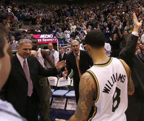 Trent Nelson  |  The Salt Lake Tribune
Utah Jazz guard Deron Williams (8) walks off the court following the Jazz victory. Jazz coaches Phil Johnson (left) and Jerry Sloan at rear. Utah Jazz vs. Los Angeles Lakers, NBA basketball Friday, November 26, 2010 at EnergySolutions Arena.