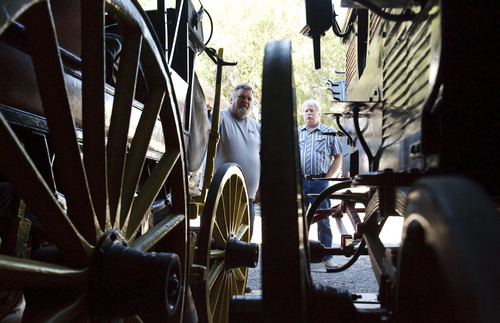 Leah Hogsten  |  The Salt Lake Tribune 

Eli Anderson, left, with his friend and wagon restorer Roland Bringhurst. Anderson is owner of Wagon Land Adventures and owns 250 wagons. Anderson's love affair with wagons from the by-gone era began in his teens and his collection contains unrestored and restored wagons of all types including mortuary, fire, culinary, dry goods, sleighs, military and stagecoaches.