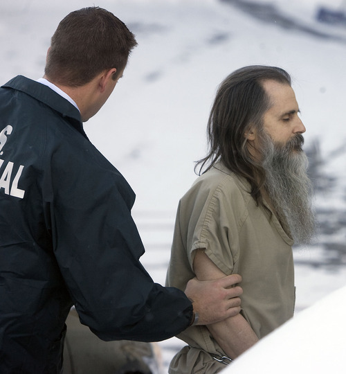 Al Hartmann  |  The Salt Lake Tribune
A shackled Brian David Mitchell is spotted by federal marshall as he makes his way across snowy lot into the Frank Moss Federal Building in Salt Lake City on Monday, Nov. 28. Trial resumes on charges he kidnapped Elizabeth Smart.