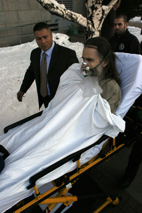 Francisco Kjolseth  |  The Salt Lake Tribune
Brian David Mitchell is taken out of Federal Court in a stretcher after collapsing in court during his federal kidnapping trial in Salt Lake City on Tuesday, Nov. 30, 2010.