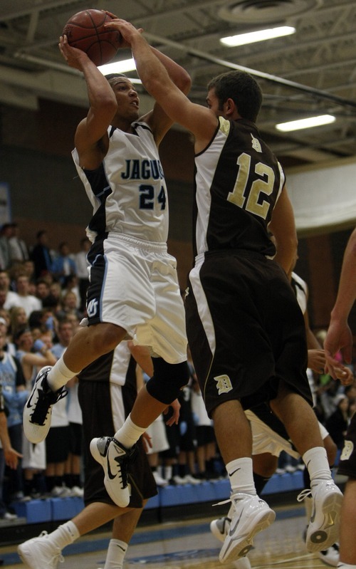 Chris Detrick  |  The Salt Lake Tribune 
West Jordan's Jordan Pryor #24 is guarded by Davis' Blake Harris #12 during the basketball game at West Jordan High School Tuesday November 30, 2010.