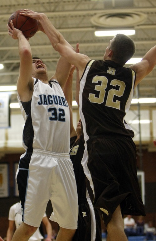 Chris Detrick  |  The Salt Lake Tribune 
West Jordan's Skyler Ford #32 is guarded by Davis' Riley Watts #32 during the basketball game at West Jordan High School Tuesday November 30, 2010.