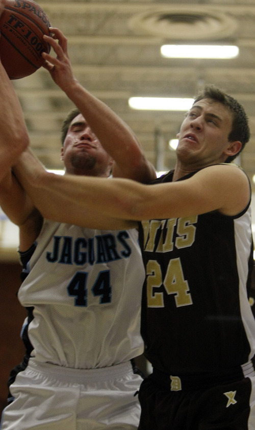 Chris Detrick  |  The Salt Lake Tribune 
West Jordan's Jaxon Knighton #44 and Davis' Tyson Denney #24 go up for a rebound during the basketball game at West Jordan High School Tuesday November 30, 2010.