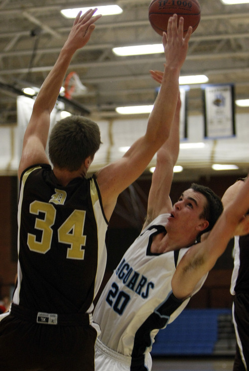 Chris Detrick  |  The Salt Lake Tribune 
Davis' Morgan Dunford #34 guards West Jordan's Seth Barrus #20 during the basketball game at West Jordan High School Tuesday November 30, 2010.