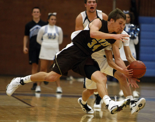 Chris Detrick  |  The Salt Lake Tribune 
Davis' Morgan Dunford #34 steals the ball from West Jordan's Chase Hawker #3 during the basketball game at West Jordan High School Tuesday November 30, 2010.