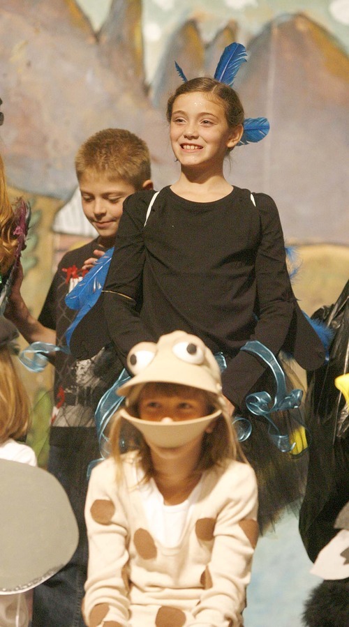 Paul Fraughton | The Salt Lake Tribune
Ashlynn Suarez plays a tree swallow and Maddie Wagner plays a northern leopard frog in Buffalo Point Elementary School's opera, 