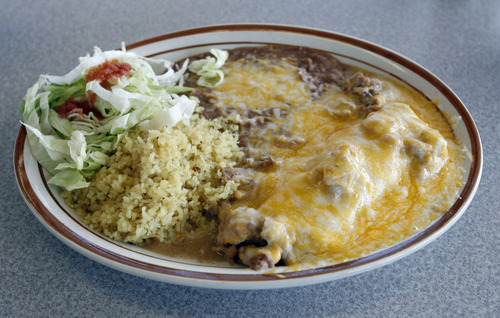 Francisco Kjolseth  |  The Salt Lake Tribune
La Morena Mexican restaurant's enchilada, topped with enchilada sauce, cheese and smothered with chile verde.