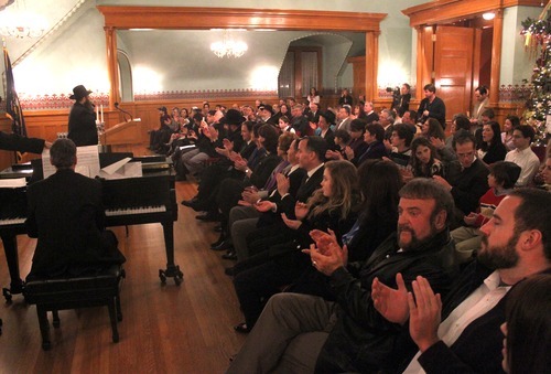 Rick Egan   |  The Salt Lake Tribune

 
Guests clap as Cantor Zalman Baumgarten sings an interlude of peace, during the Chanukah Ceremony at the Governors Mansion, Thursday, December 2, 2010