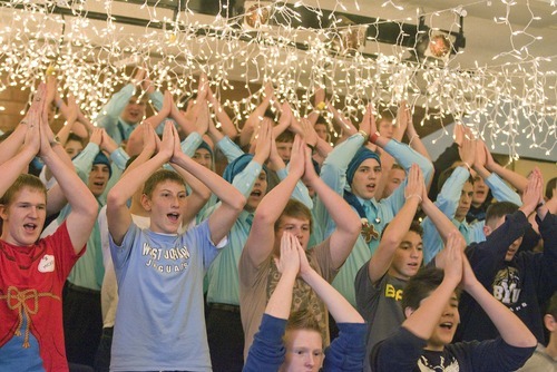 Paul Fraughton  |  The Salt Lake Tribune  With their choir room decorated for the holidays, members of the  West Jordan High School choir, under the direction of  Kelly DeHaan,  rehearse their songs and expressive actions  for an upcoming Christmas concert  with the Utah Symphony.
