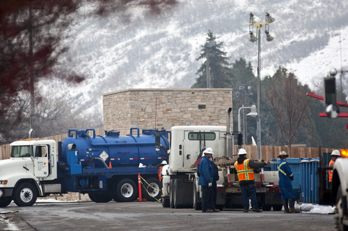 Chris Detrick  |  The Salt Lake Tribune 
Crews work at cleaning up the oil spill near the entrance to Red Butte Garden at the University of Utah Saturday December 4, 2010.  Chevron said the leak is at least two to three times larger than previously estimated.