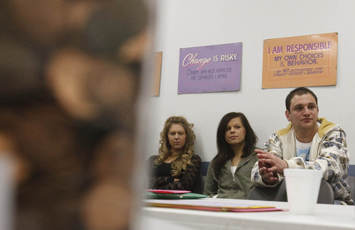 Leah Hogsten  |  The Salt Lake Tribune
Left to right, Lynda Weight, Anja Sikkema and Josh Avery discuss how they saved their change to feed the homeless. Drug court assigned students in an education program at Salt Lake County's criminal justice division are giving back to the community for the holidays. Instructor Meredith Franck challenged the class to collect their pennies to feed one homeless person on Thanksgiving. The students gathered enough to feed at least 40 people.
 Wednesday, November 17, 2010, in SLC.