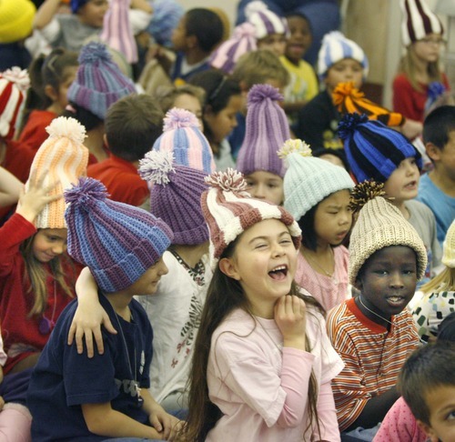 Paul Fraughton  |  The Salt Lake Tribune   Ashlyn Cleveland,  a second-grader  at Oquirrh Hills Elementary in Kearns, shows her excitement after trying on her new hat made by prison inmate Robert E. Jones.  Friday, December 3, 2010