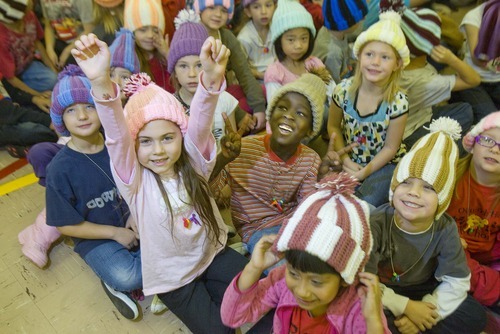 Paul Fraughton  |  The Salt Lake Tribune   Ashlyn Cleveland, a second-grader at Oquirrh Hills Elementary in Kearns, surrounded by classmates, shows her excitement after trying on her new hat made by prison inmate Robert E. Jones.  Friday, December 3, 2010
