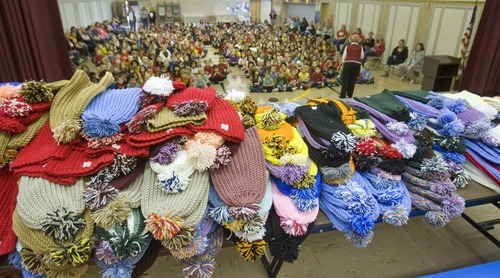 Paul Fraughton  |  The Salt Lake Tribune  Crocheted hats made by prison inmate Robert Jones fill a table on the stage at Oquirrh Hills Elementary School in Kearns. Every student and teacher in the school received a hat made by the convicted murderer on Friday, December 3, 2010.