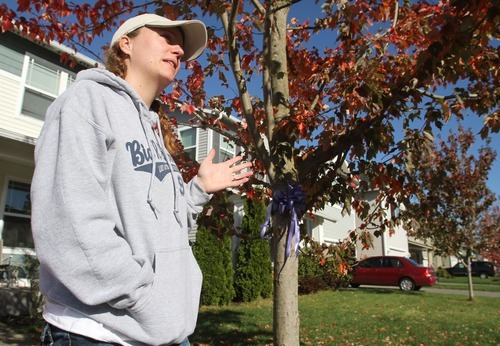 Rick Egan  | The Salt Lake Tribune
Danielle Hill talks about the purple bow controversy outside her home, which is located a few blocks from Steve Powell's home in Puyallup,  Wash. HIll helped Colleen Russell hang bows and posters in the neighborhood last spring.