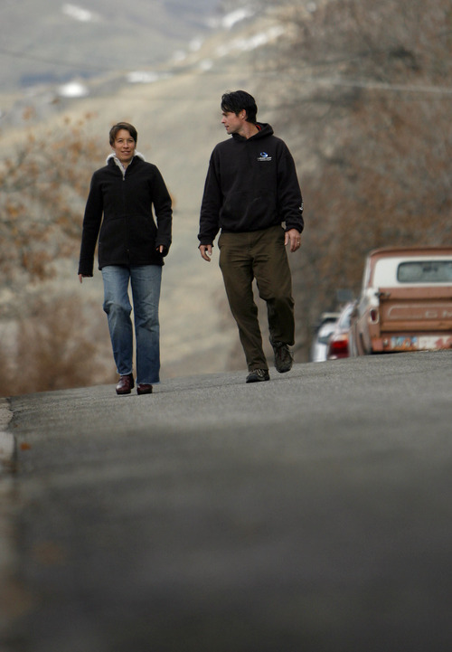 Francisco Kjolseth  |  The Salt Lake Tribune
Ryan and Jamie Pleune walk their neighborhood near the Capitol after completing a 350-mile walk intended to personify the limit of the amount of carbon dioxide in the atmosphere. They've added the latest Red Butte oil spill as a matter of protest.