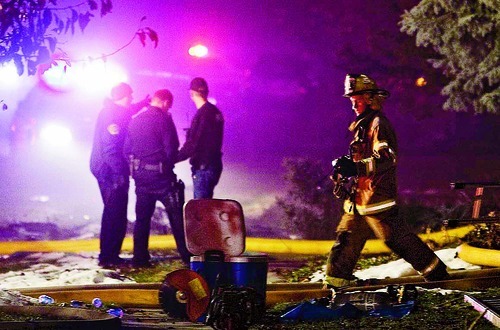 Trent Nelson  |  The Salt Lake Tribune
Firefighters at the scene of a plane crash Sunday, December 5, 2010 in Roy.