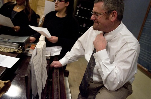 Djamila Grossman  |  The Salt Lake Tribune

Conductor Gregory Glenn looks at a sheet of music notes as he directs the Cathedral of the Madeleine Hispanic Choir during a rehearsal at the cathedral in Salt Lake City on Thursday, Dec. 2, 2010.
