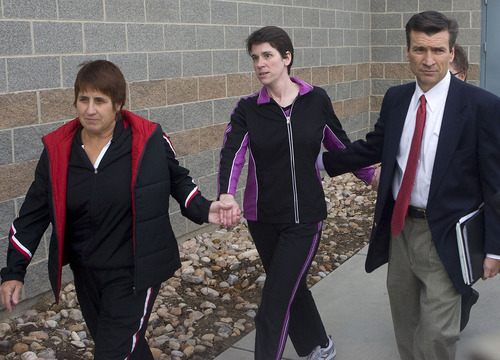 Al Hartmann  |  The Salt Lake Tribune 
Pamela Ann Mortensen, center,  leaves the Utah County jail hand in hand with her sister, left, and lawyer Greg Skordas, right,  just after noon on Wednesday, Dec. 8, after murder charges were dropped.