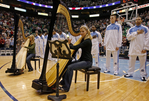 Steve Griffin  |  The Salt Lake Tribune

Elizabeth Smart, right, and sister Mary Katherine Smart play the National Anthem on their harps before the Jazz-Clippers game at EnergySolutions Arena on Dec. 26, 2006.