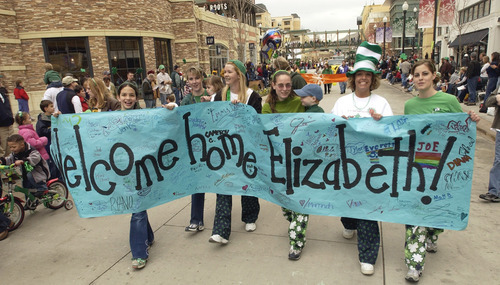 Al Hartmann  |  The Salt Lake Tribune

Participants in the 2003 St. Patrick's Day Parade at the Gateway celebrate her return a few days after she was found in Sandy in March 2003.
