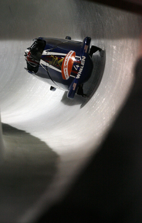 Francisco Kjolseth  |  The Salt Lake Tribune
John Napier of the United States drives his team sled to a 11th place finish as athletes from around the world compete in the World Cup tour in the four man bobsled at Utah Olympic Park in Park City on Saturday, Dec. 11, 2010.