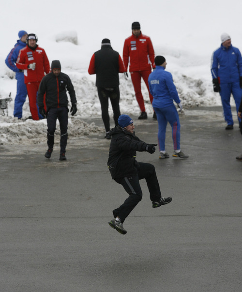 Francisco Kjolseth  |  The Salt Lake Tribune
Athletes from around the world loosen up before competing in the World Cup tour in the four man bobsled at Utah Olympic Park in Park City on Saturday, Dec. 11, 2010.