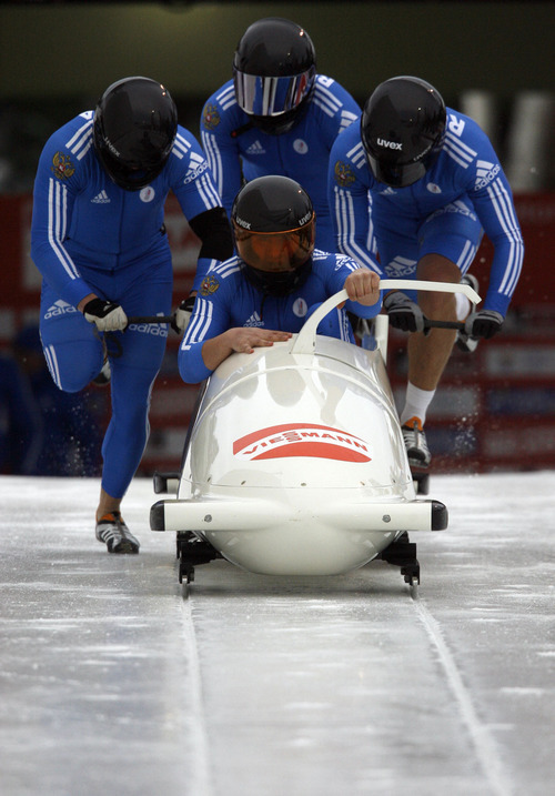 Francisco Kjolseth  |  The Salt Lake Tribune
Russias Alexander Kasjanov, Andrey Yurkov, Dmitry Stepushkin and Maxim Belugin power down the track in the four man bobsled. Athletes from around the world compete in the World Cup tour in the four man bobsled at Utah Olympic Park in Park City on Saturday, Dec. 11, 2010.