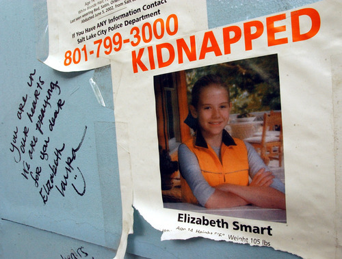 Rick Egan  |  The Salt Lake Tribune

A poster for Elizabeth Smart and a note are seen on a kiosk on Main Street in Salt Lake City shortly after Elizabeth Smart's abduction from her Salt Lake City home in 2002.