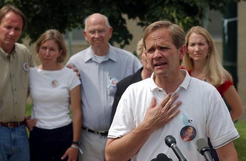 Paul Fraughton  |  The Salt Lake Tribune

With members of his extended family standing behind him, Ed Smart says that he believes his daughter is still alive.  His comments came at a news conference announcing an additional $25,000 for information leading to the location of Elizabeth Smart or for information leading to the arrest of people involved in the abduction.
