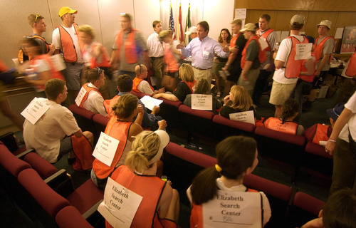 Steve Griffin  |  The Salt Lake Tribune

Volunteers are briefed in the auditorium of Shriner's Hospital in Salt Lake City prior to departing on their search assignments June 7, 2002. Hundreds of volunteers again showed up to due what ever they could in search efforts for Elizabeth Smart, who was kidnapped from her home June 5, 2002.