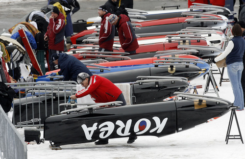 Francisco Kjolseth  |  The Salt Lake Tribune
Officials use 600 grit sandpaper to make exactly 5 pases on each rail of all the teams in the bobsled competition before the first race to ensure no foreign substances. Athletes from around the world compete in the World Cup tour in the four man bobsled at Utah Olympic Park in Park City on Saturday, Dec. 11, 2010.