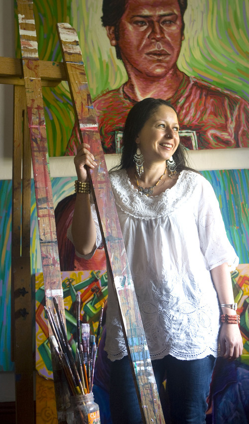 Al Hartmann  |  The Salt Lake Tribune 
Ruby Chacon artist and curator of Mestizo gallery stands next to an art easel she received for Christmas when she was 20 years old.  She still uses it today in her studio.