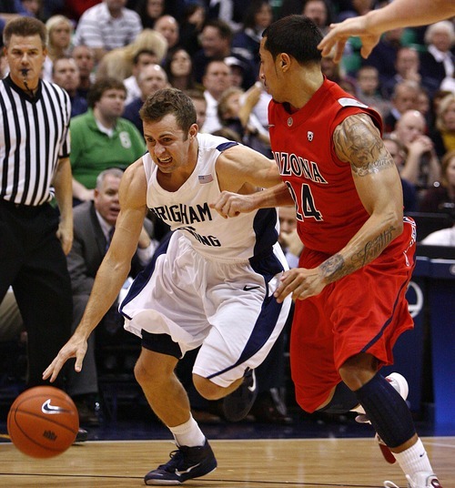 Djamila Grossman  |  The Salt Lake Tribune

Brigham Young University's Jackson Emery, 4, drives the ball toward the basket as the University of Arizona's Brendon Lavender, 24, guards him, during the second half of a game in Salt Lake City, on Saturday, Dec. 11, 2010. BYU won the game.