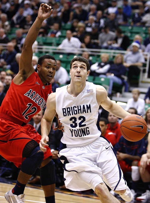 Djamila Grossman  |  The Salt Lake Tribune

Brigham Young University's Jimmer Fredette, 32, drives the ball to the basket as the University of Arizona's Lamont Jones, 12, blocks him, in a game in Salt Lake City, on Saturday, Dec. 11, 2010. BYU won the game.