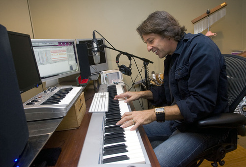 Al Hartmann  |  The Salt Lake Tribune 
Utah composer Kurt Bestor prepares for his 22nd annual Christmas concert series at his home studio.  He uses modern technology to compose his music and connect with his band members and audiences.  He often composes with one hand on a music keyboard and the other on a computer keyboard.