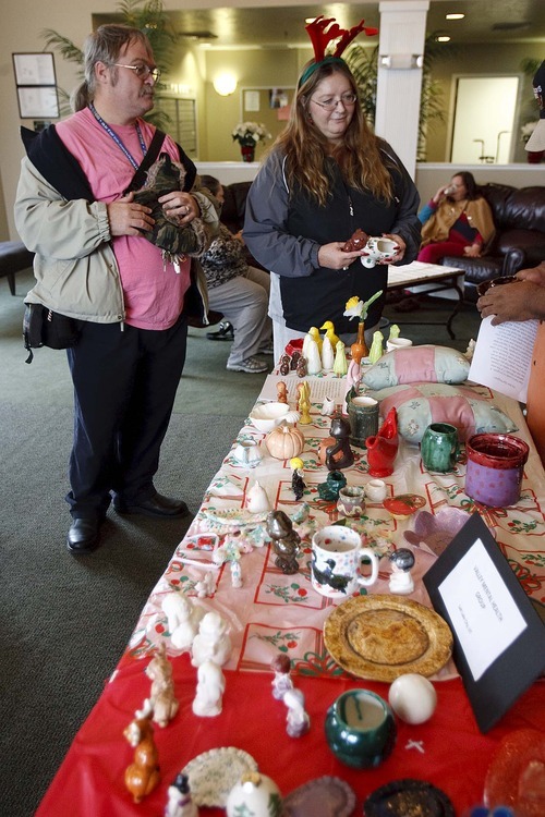 Trent Nelson | The Salt Lake Tribune
Troy Coltharp, left, and Amy Byrd are part of a group from Valley Mental Health's Fresh Start program that gave away arts and crafts to seniors at an assisted living center Dec. 8. Fresh Start is a peer-run program at Valley Mental Health. Members put on classes in art, language and crafts and are able to build friendships and receive support.