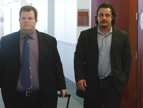 Leah Hogsten  |  The Salt Lake Tribune
A state court judge on Wednesday, December 15, 2010, in Salt Lake City convicted mixed-martial arts fight promoter Mike Stidham (right, walking with attorney Tyler Ayres) of felony assault. Stidham's co-defendant, Salvador Sanchez, also was convicted by 3rd District Judge Ann Boyden, who presided in the bench trial requested by the two men. The third-degree felonies carry a possible prison sentence of up to five years, but both men are likely to ask for probation only.