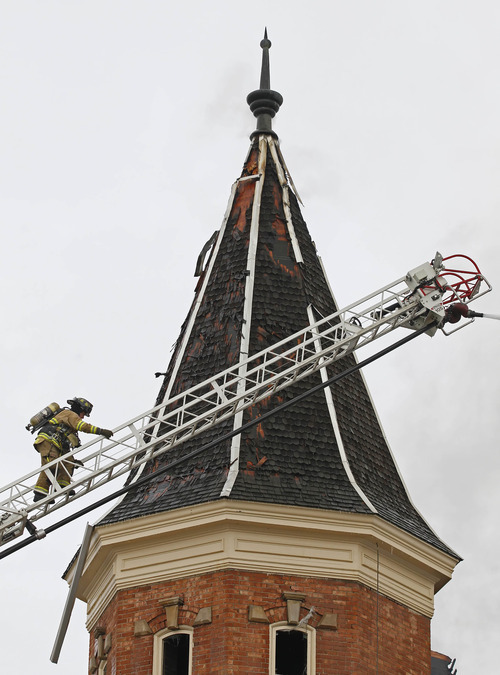 Provo firefighters battle a fire at the historic Provo Tabernacle Friday, Dec. 17, 2010 in Provo.  The historic tabernacle, which is owned by the Mormon church and is used for religious services and community events, was built in 1873. (AP Photo/George Frey)