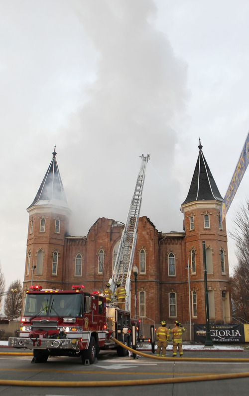 Provo firefighters battle a fire at the historic Provo Tabernacle Friday, Dec. 17, 2010 in Provo.  The historic tabernacle, which is owned by the Mormon church and is used for religious services and community events, was built in 1873. (AP Photo/George Frey)