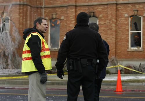 Rick Egan   |  The Salt Lake Tribune

Provo Mayor John Curtiss (yellow vest) talks to Provo policemen in front of the Provo Tabernacle, Friday, December 17, 2010.