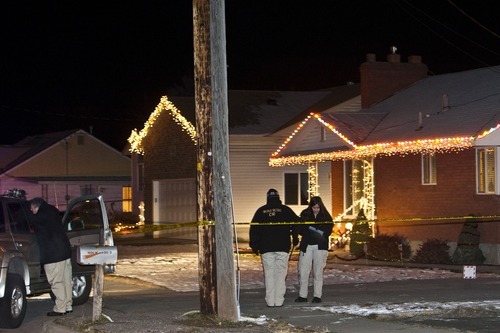 Chris Detrick  |  The Salt Lake Tribune 
Roy police investigate the scene of a fatal shooting near 1900 West and 4400 South on Thursday, Dec. 16, 2010.   A second person was also injured in the shooting that was reported at 6:30 p.m., a Weber County dispatcher said.