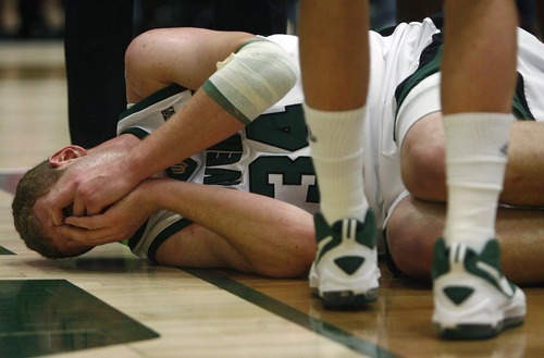 Djamila Grossman  |  The Salt Lake Tribune

Utah Valley University's Ben Aird, 34, holds his nose after a fall during the first half of a game against Utah State University at UVU, Saturday, Dec. 18, 2010.