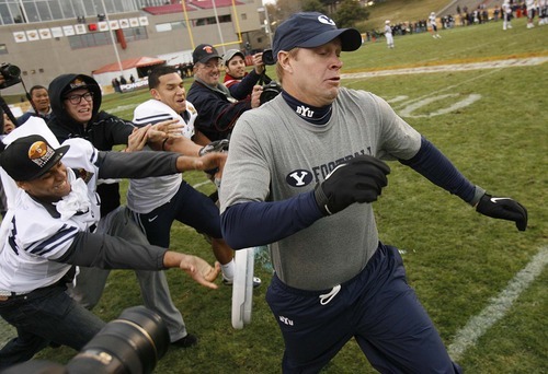 Trent Nelson  |  The Salt Lake Tribune
BYU coach Bronco Mendenhall escapes a dunking in the final minutes as BYU defeats UTEP in the New Mexico Bowl, college football Saturday, December 18, 2010 in Albuquerque, New Mexico.