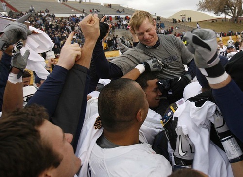 Trent Nelson  |  The Salt Lake Tribune
BYU coach Bronco Mendenhall and his players celebrate as BYU defeats UTEP in the New Mexico Bowl, college football Saturday, December 18, 2010 in Albuquerque, New Mexico.