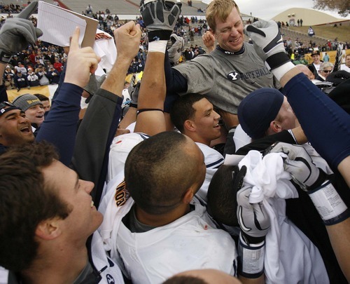 Trent Nelson  |  The Salt Lake Tribune
BYU coach Bronco Mendenhall and his players celebrate as BYU defeats UTEP in the New Mexico Bowl, college football Saturday, December 18, 2010 in Albuquerque, New Mexico.